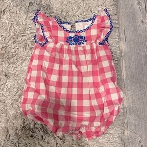 Gingham romper with snaps for easy diaper change. Only used twice.